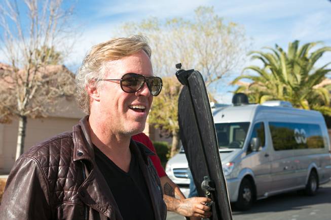 Scott Yancey, from A&E’s “Flipping Vegas,” films a quick interview explaining the progress of one of their remodeling projects Tuesday, Nov. 26, 2013.